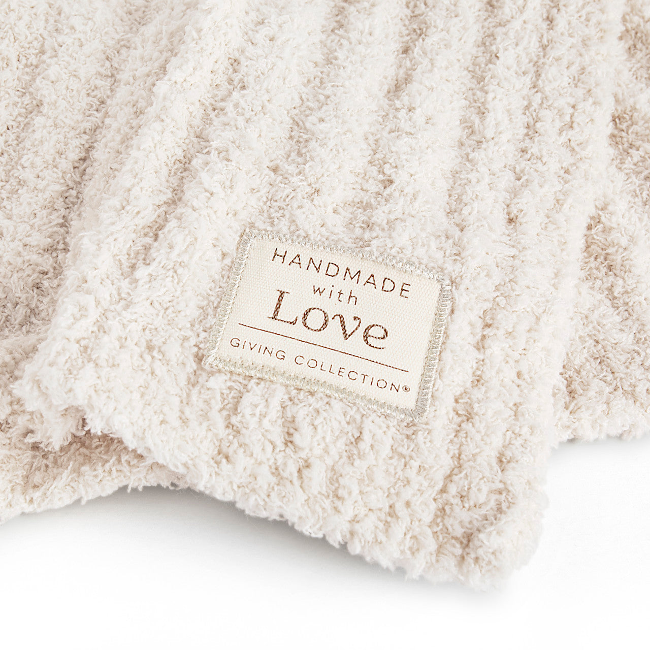 Giving Collection Cream Ribbed Throw Blanket